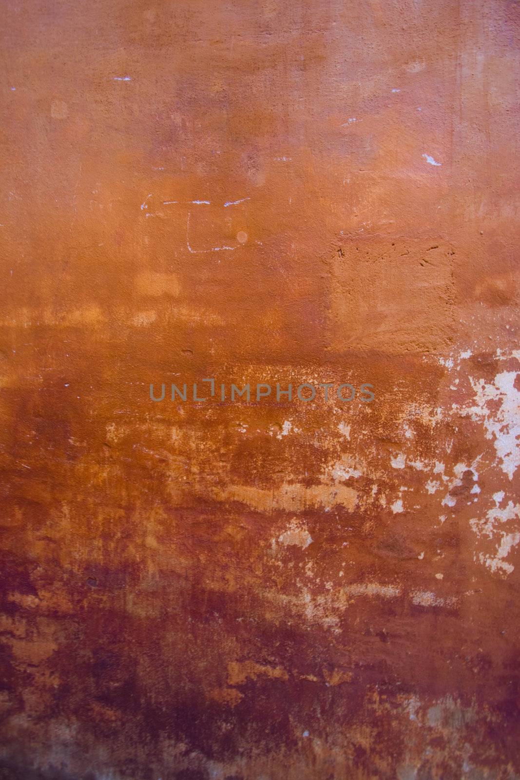 Grunge wall background with orange and brown colors