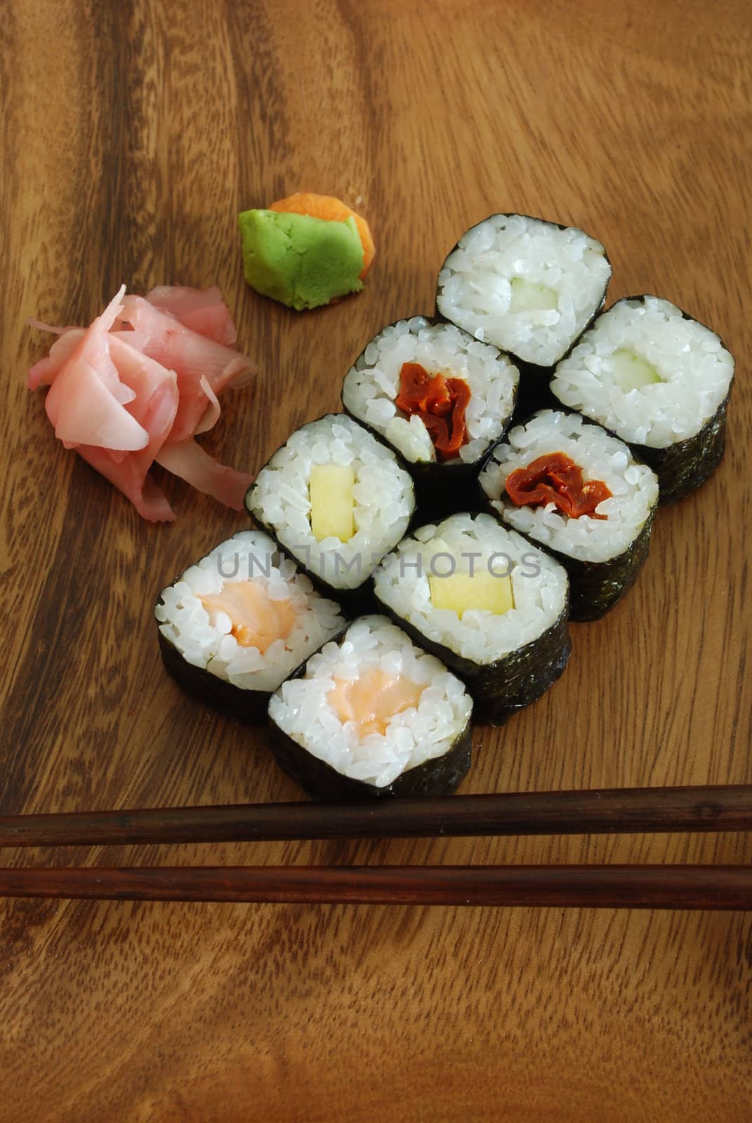 high quality photo of sushi meal (hossomaki salmon) and chopsticks