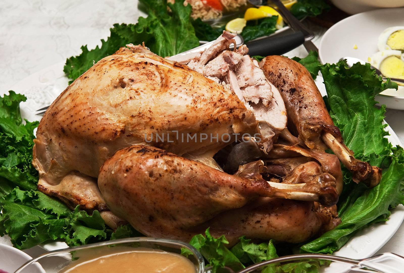 Close up of a carved turkey on a dinner table