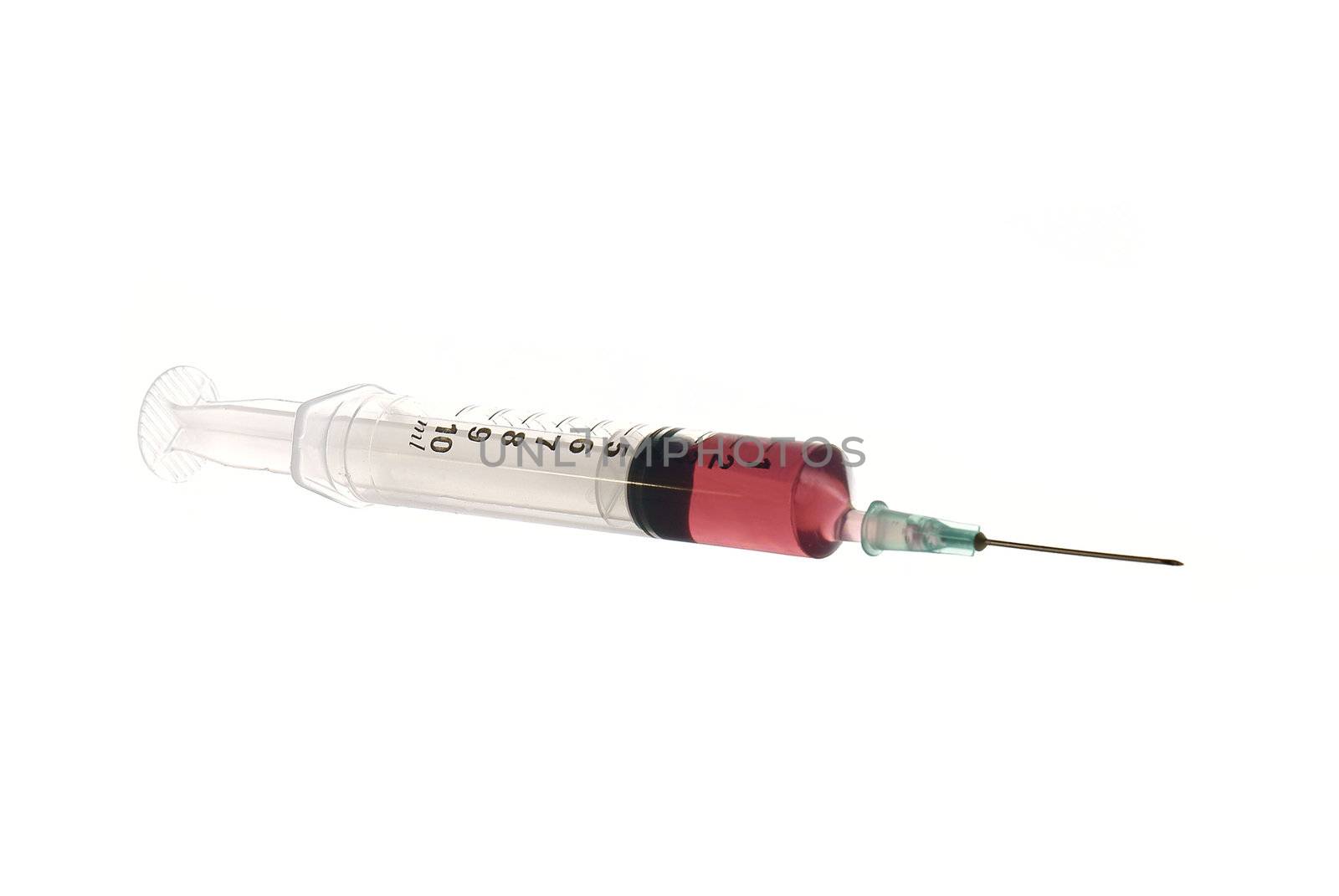 syringe and hyperdermic with red fluid