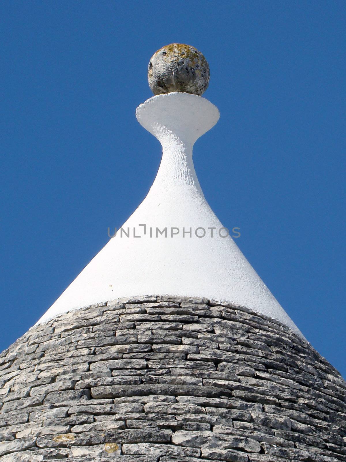 pinacle of trullo, typical building in puglia in Italy