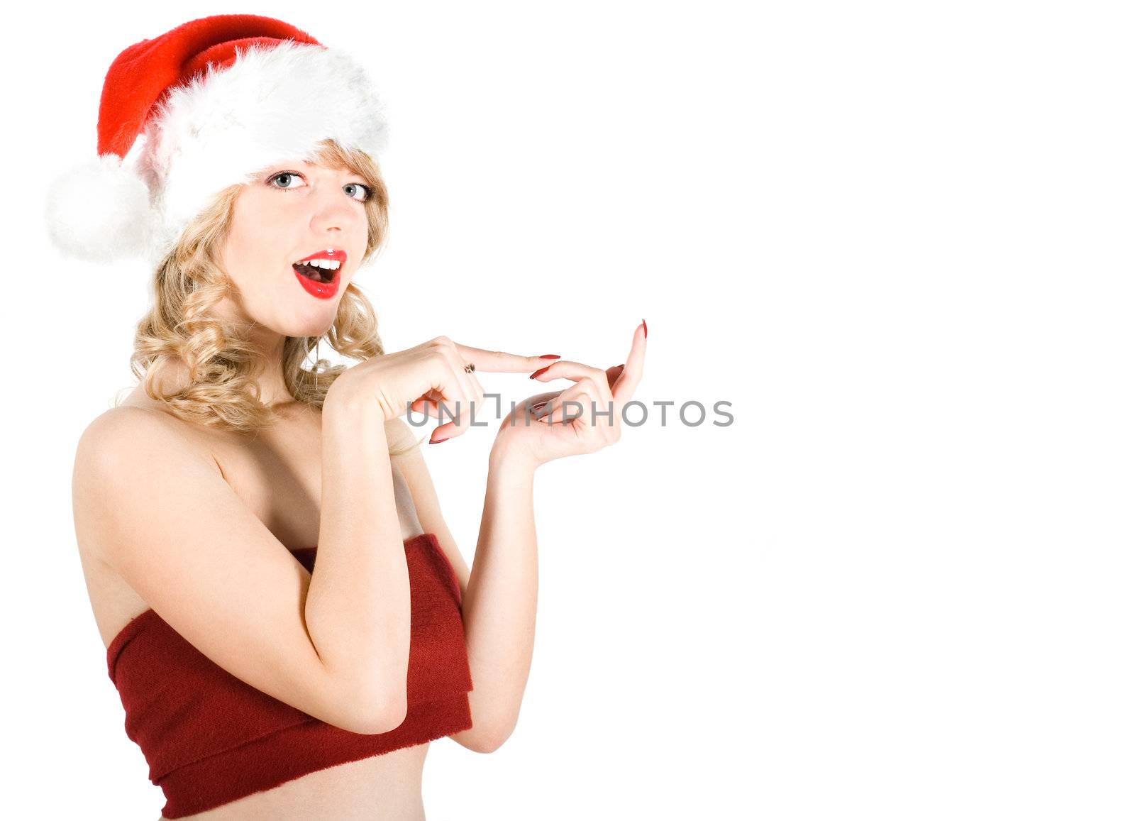 Girl in Santa hat wishing Merry Christmas