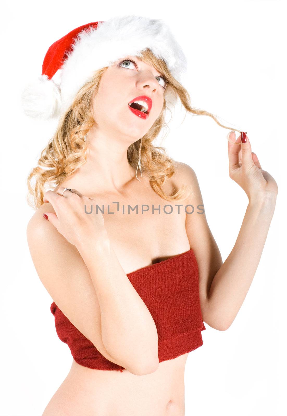 Girl in Santa hat wishing Merry Christmas
