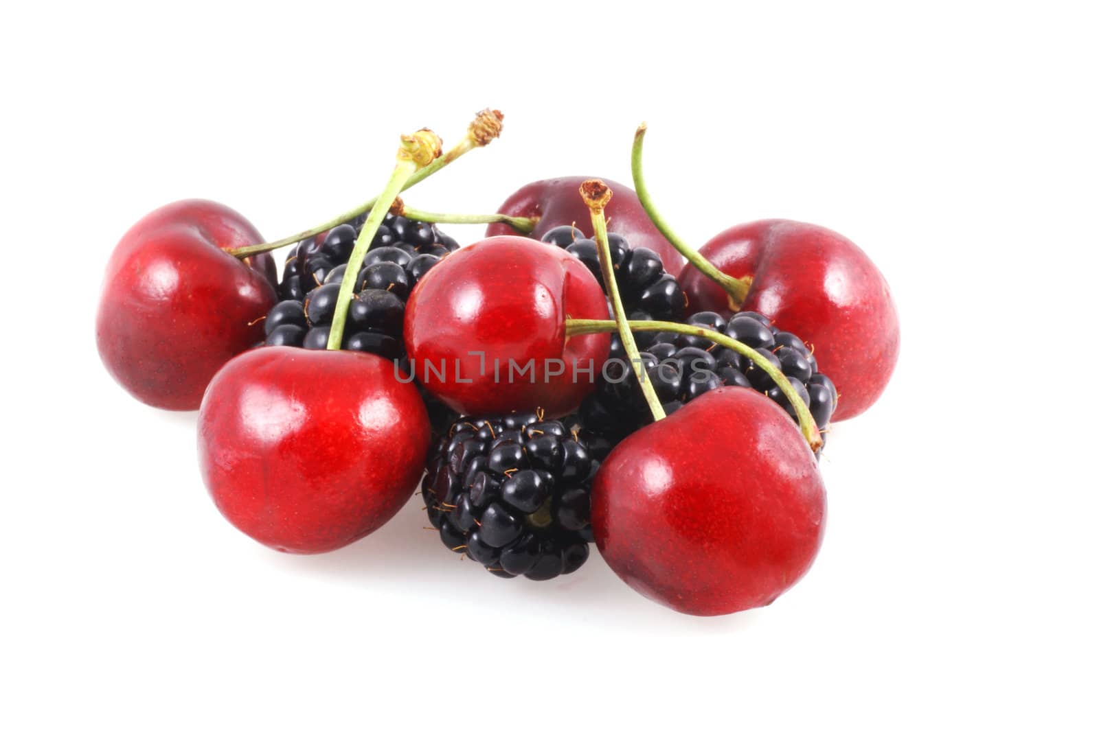 Bunch of cherries and berries isolated on a white background.
