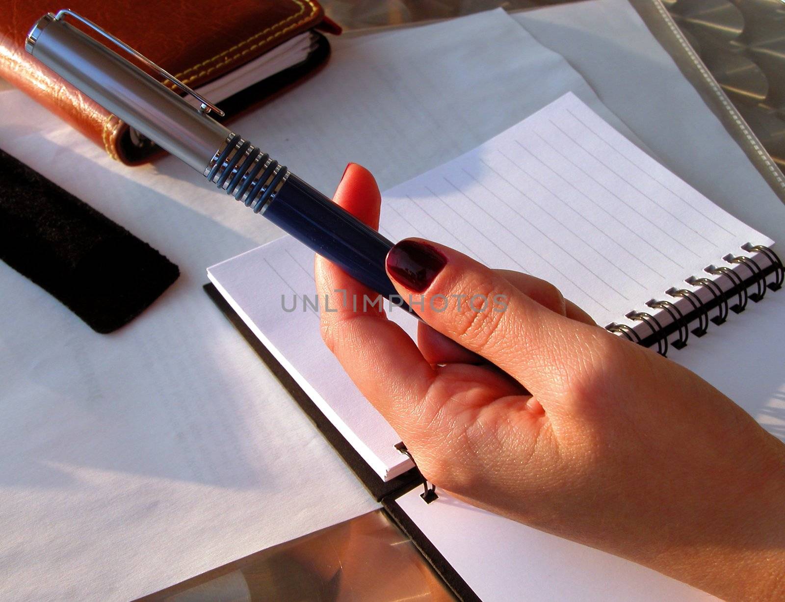 a girl offering ball-pen to a mate......          