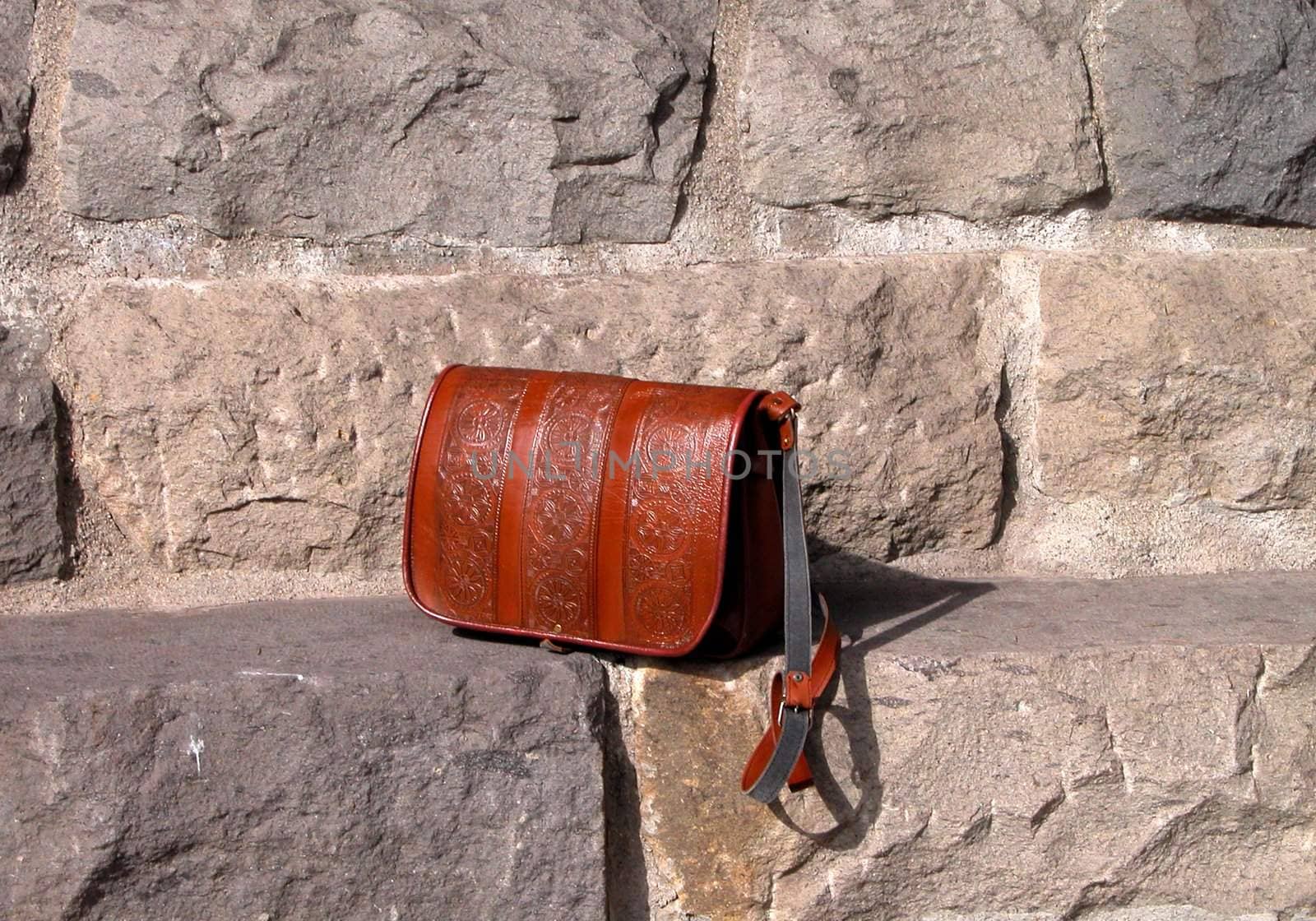  A handbag on the rocks stairs         