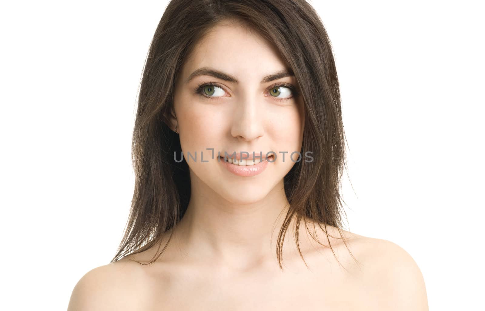 portrait of a beautiful young thoughtful woman against white background