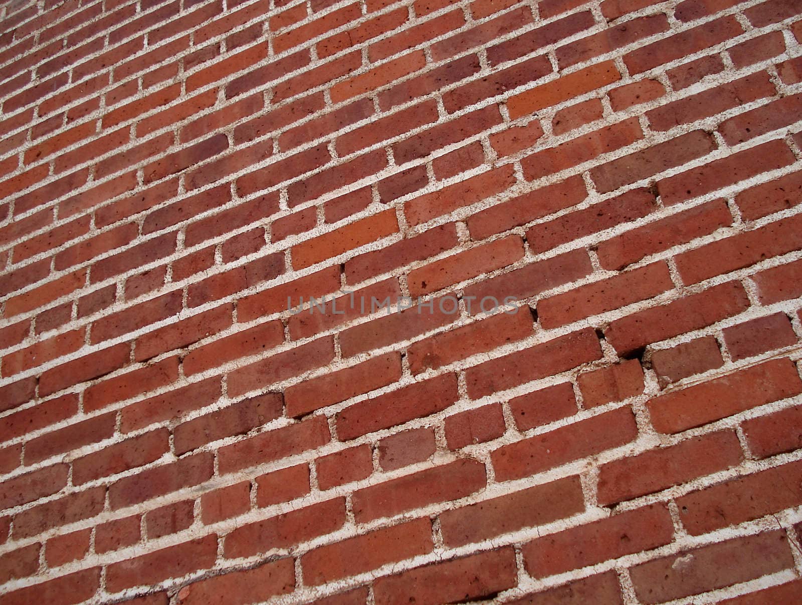 A red brick wall extends into the distance.