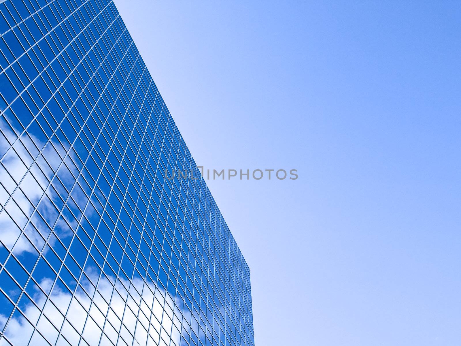 Blue sky and clouds reflected on this clear winter afternoon.