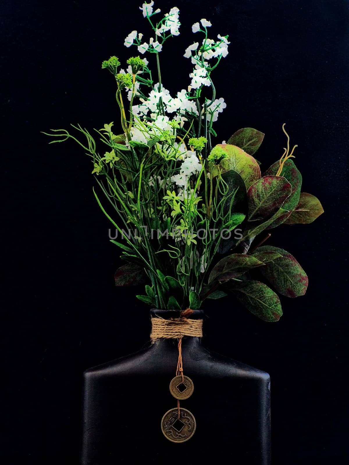 Oriental clay vase and bouquet.