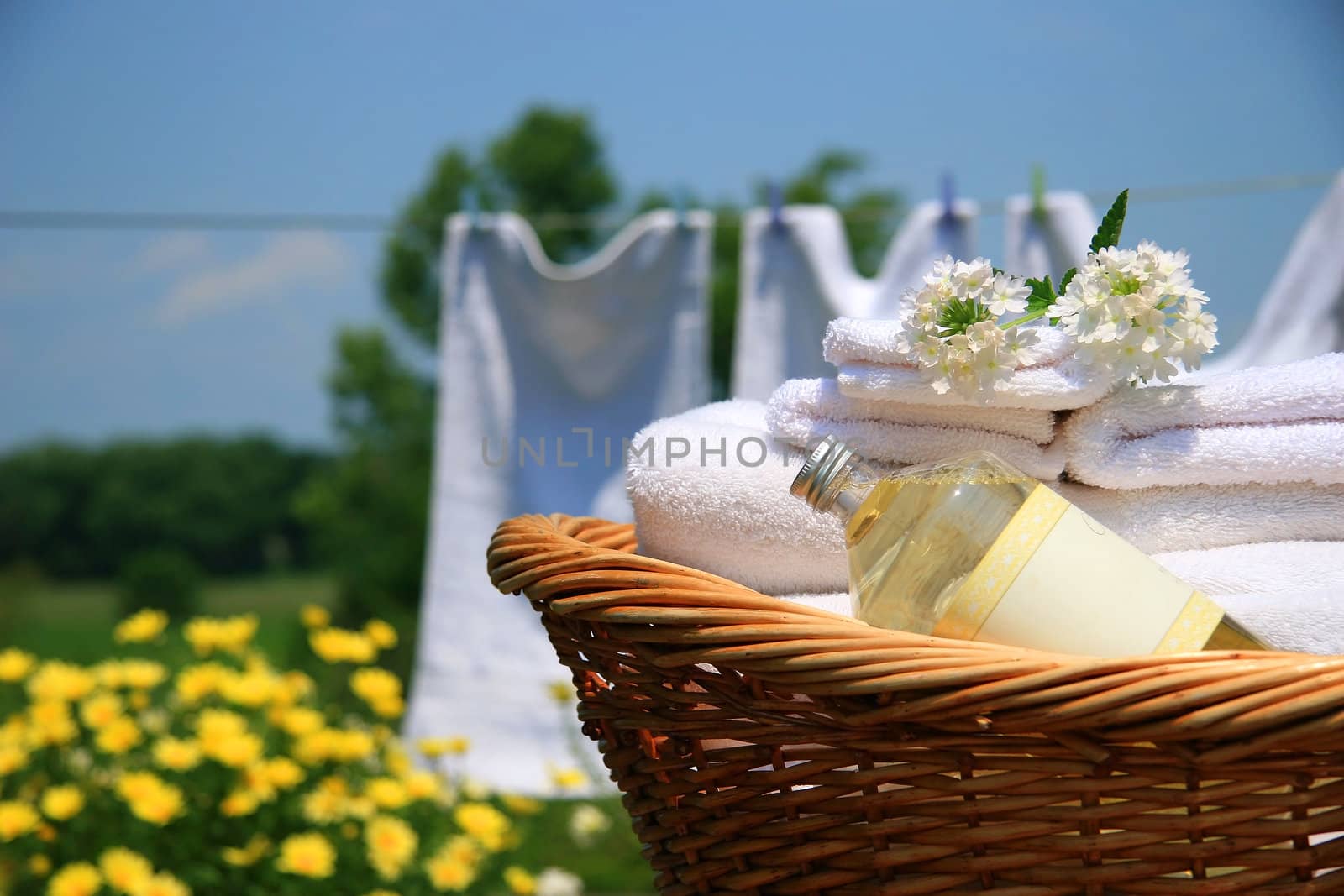 Wicker basket with laundry  by Sandralise