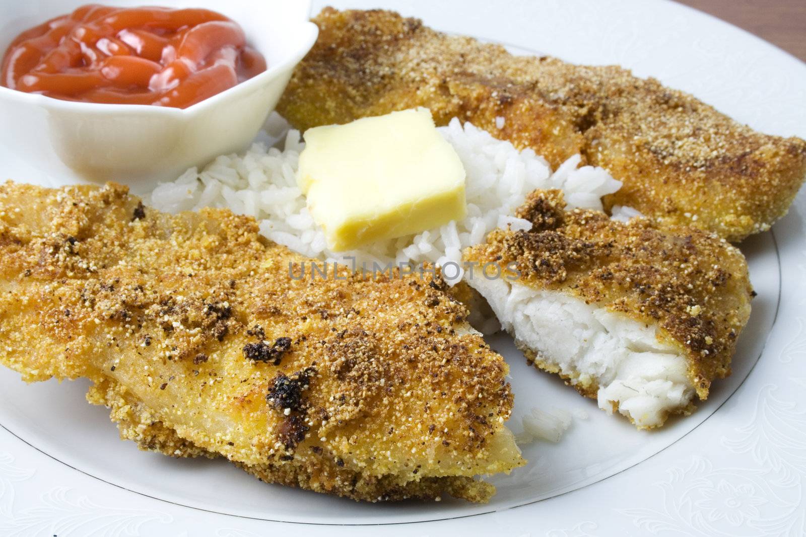 Fried fish with ketchup ready to eat or serve