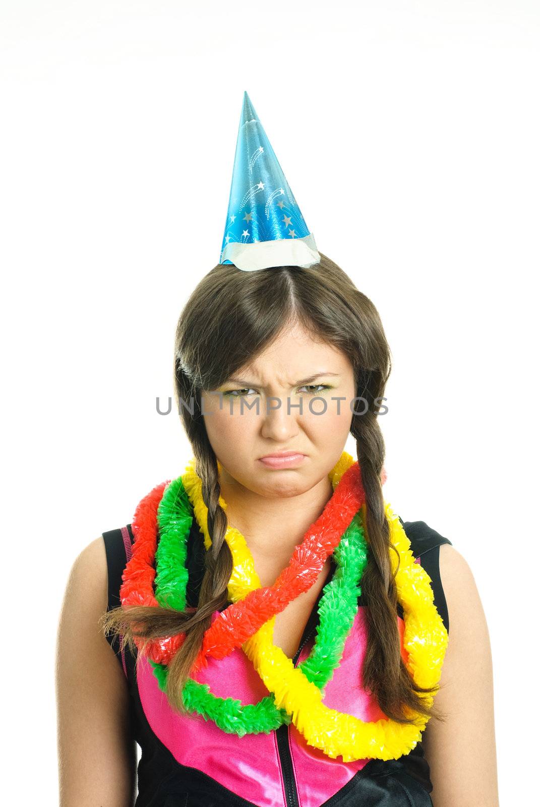 portrait of an unhappy brunette teenage girl celebrating her birthday