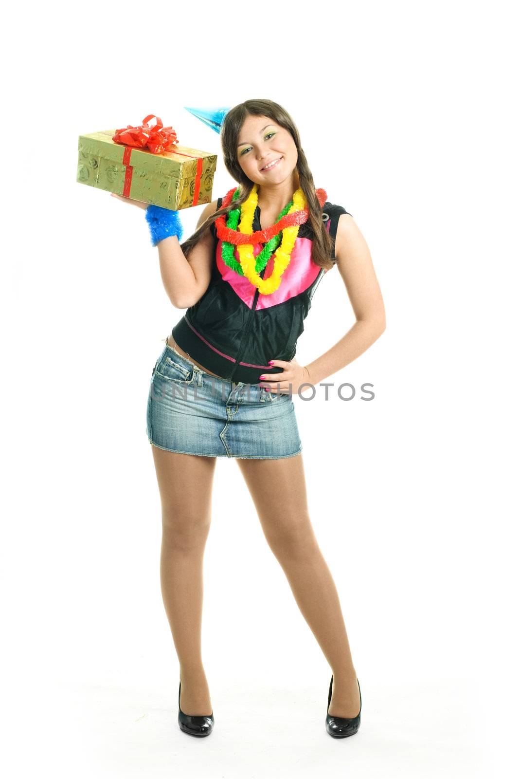 happy young beautiful girl with a present in her hands celebrating birthday