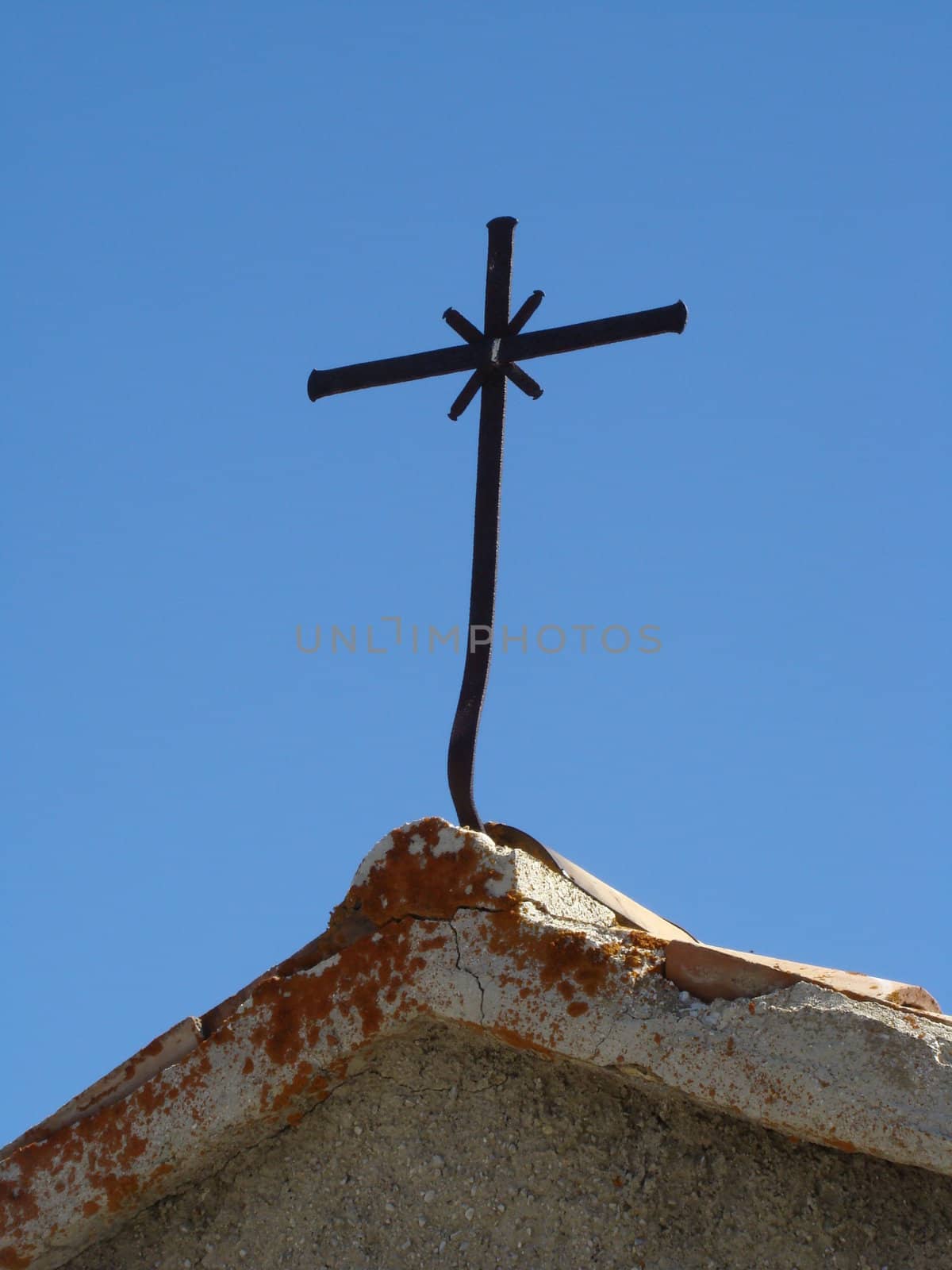 cross on the chapel in Sibillini mountains in Italy