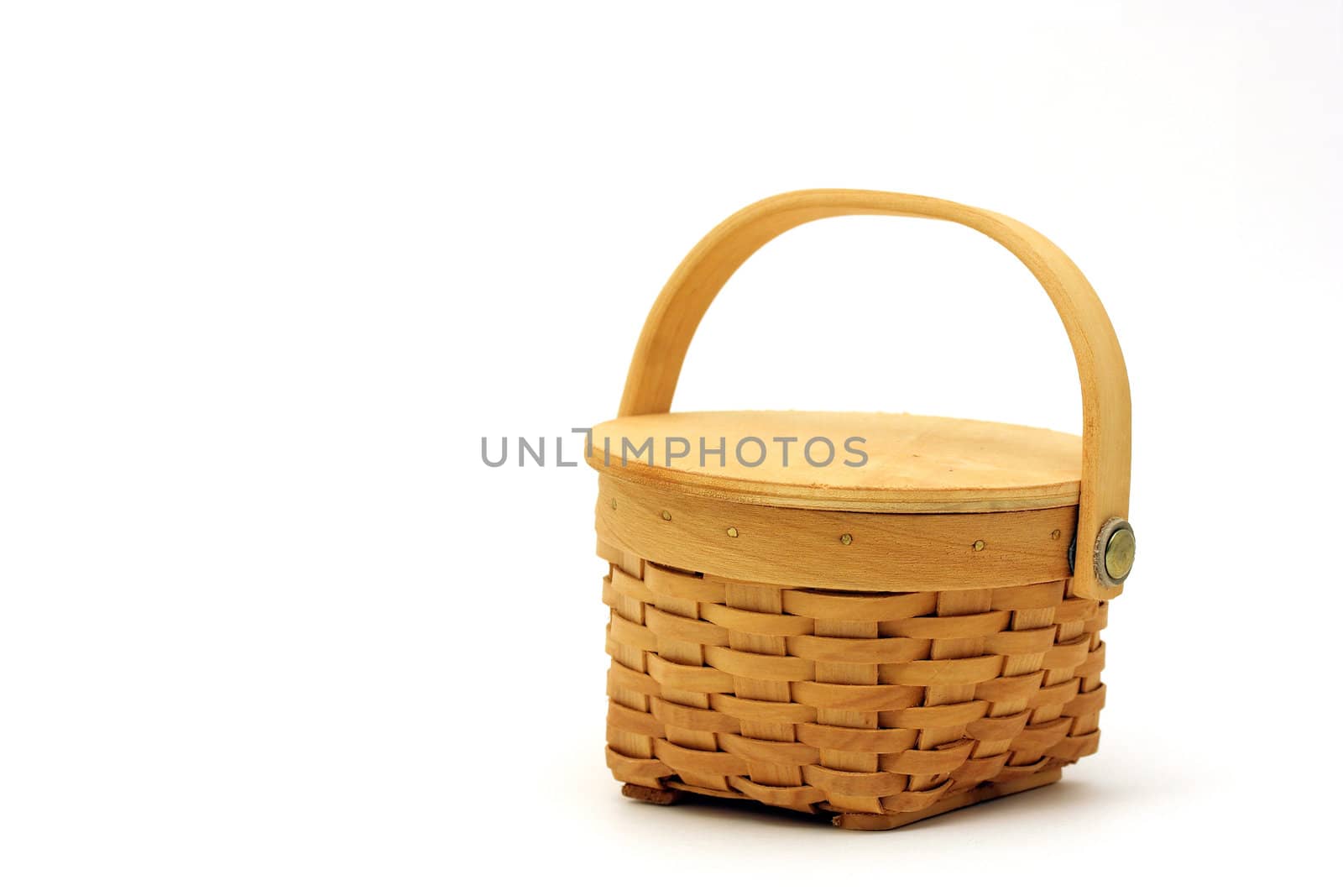 Small tan basket on white background