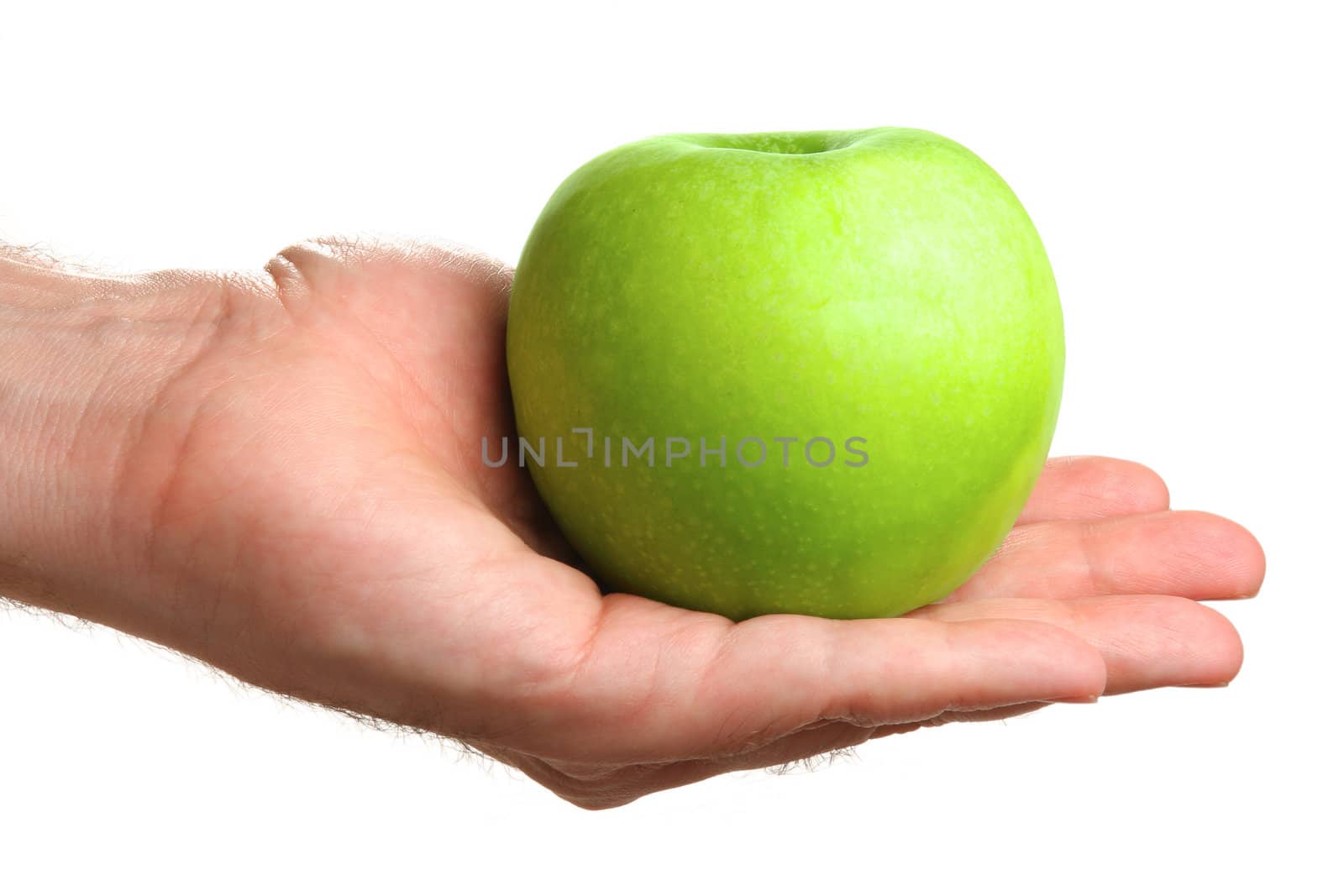 Man holding delicious green apple, isolated on white