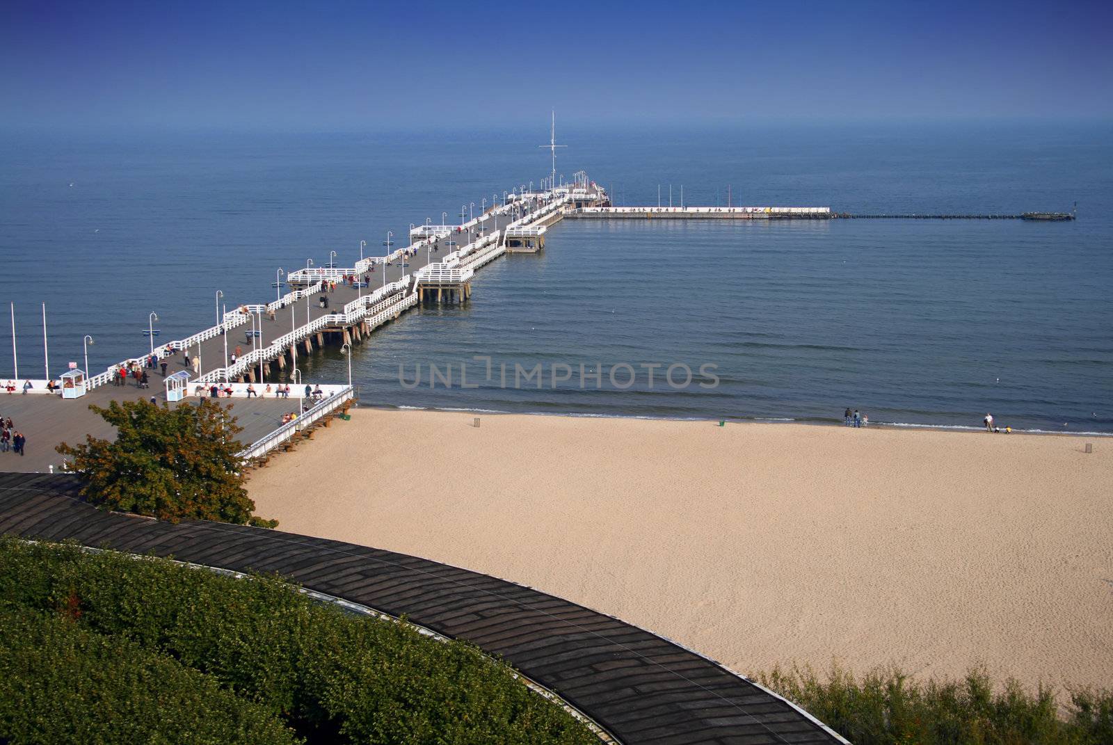 The wooden pier and beach in Sopot, Pomerania.