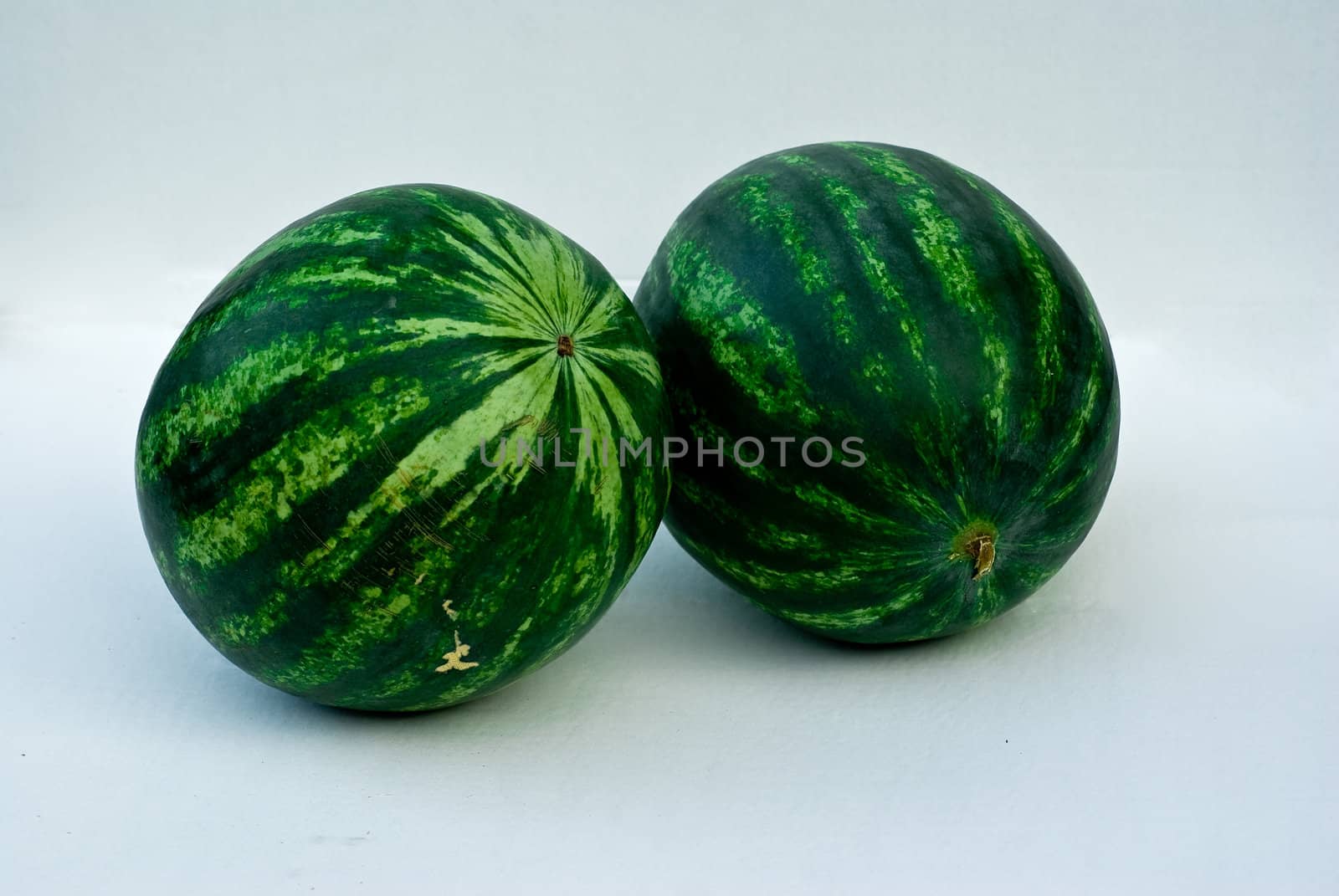 Two green striped watermelons