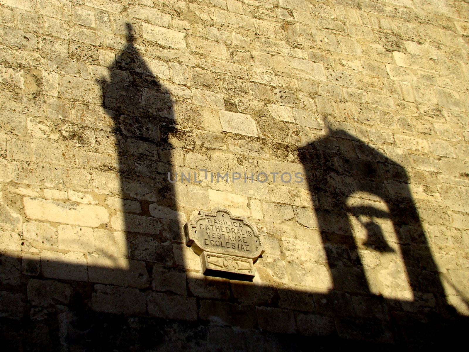 shadow of towers of the church in Vieste on Gargano 	
peninsula, Puglia region in Italy