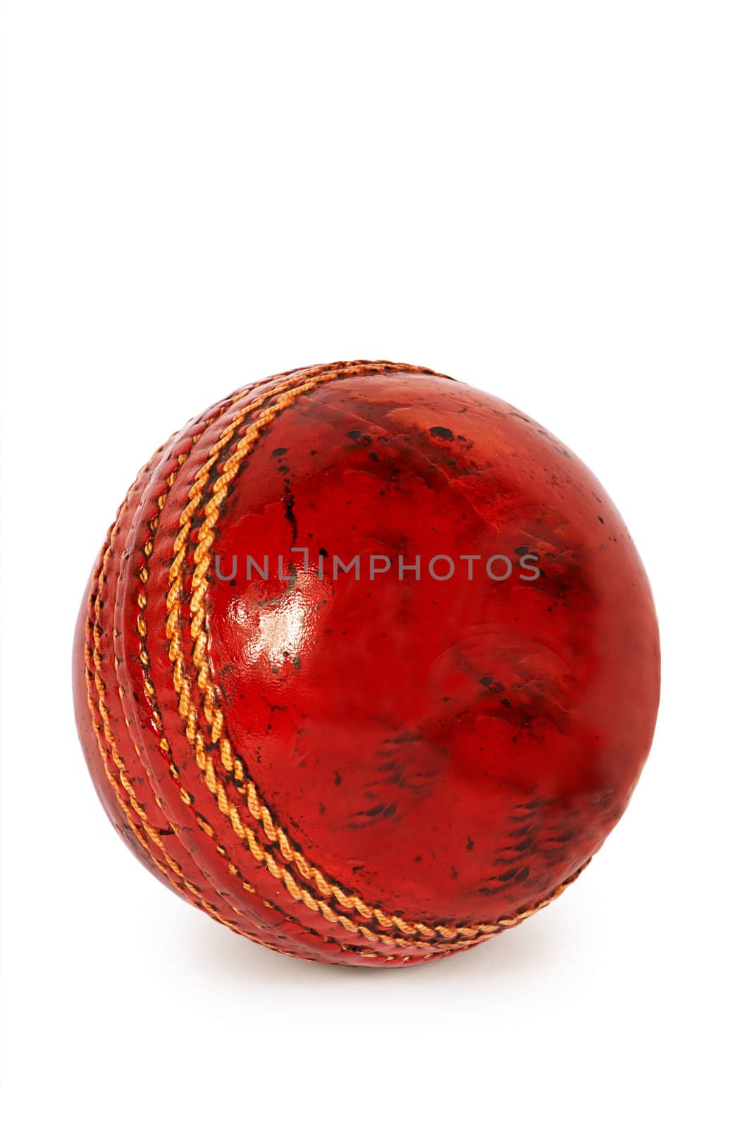 Red ball for cricket on a white background