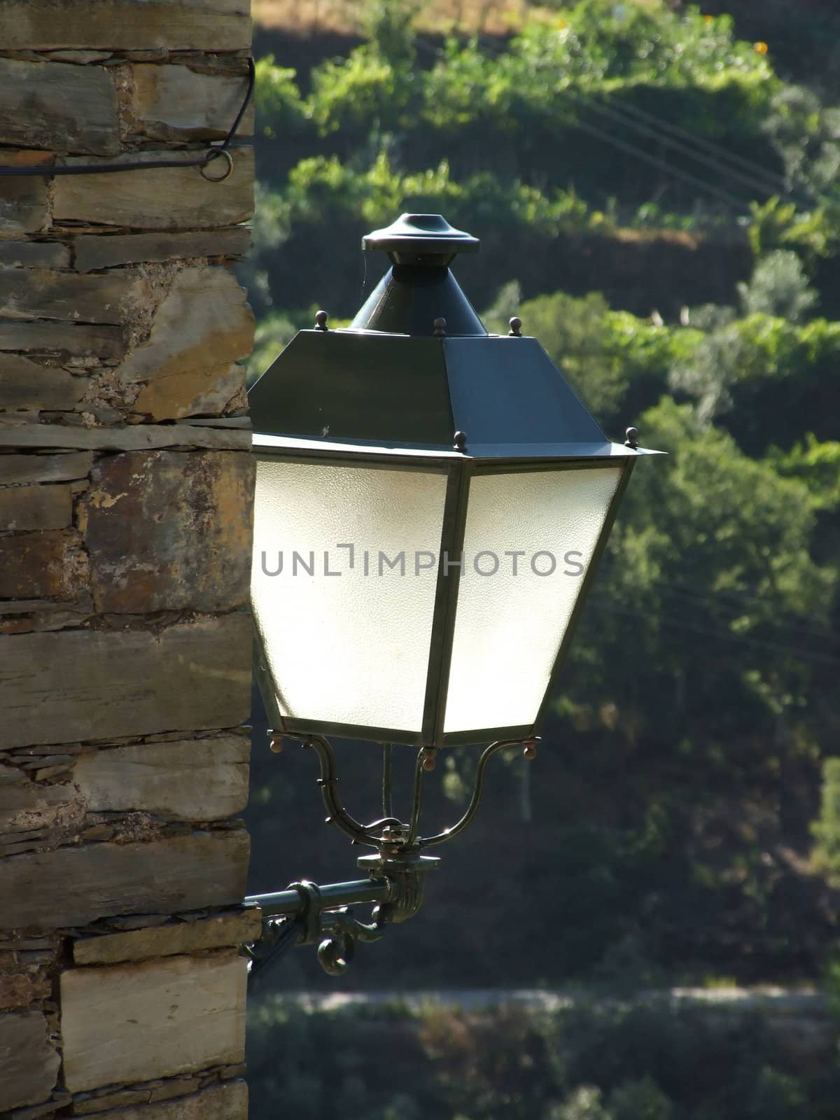 Vintage lamp on stone house