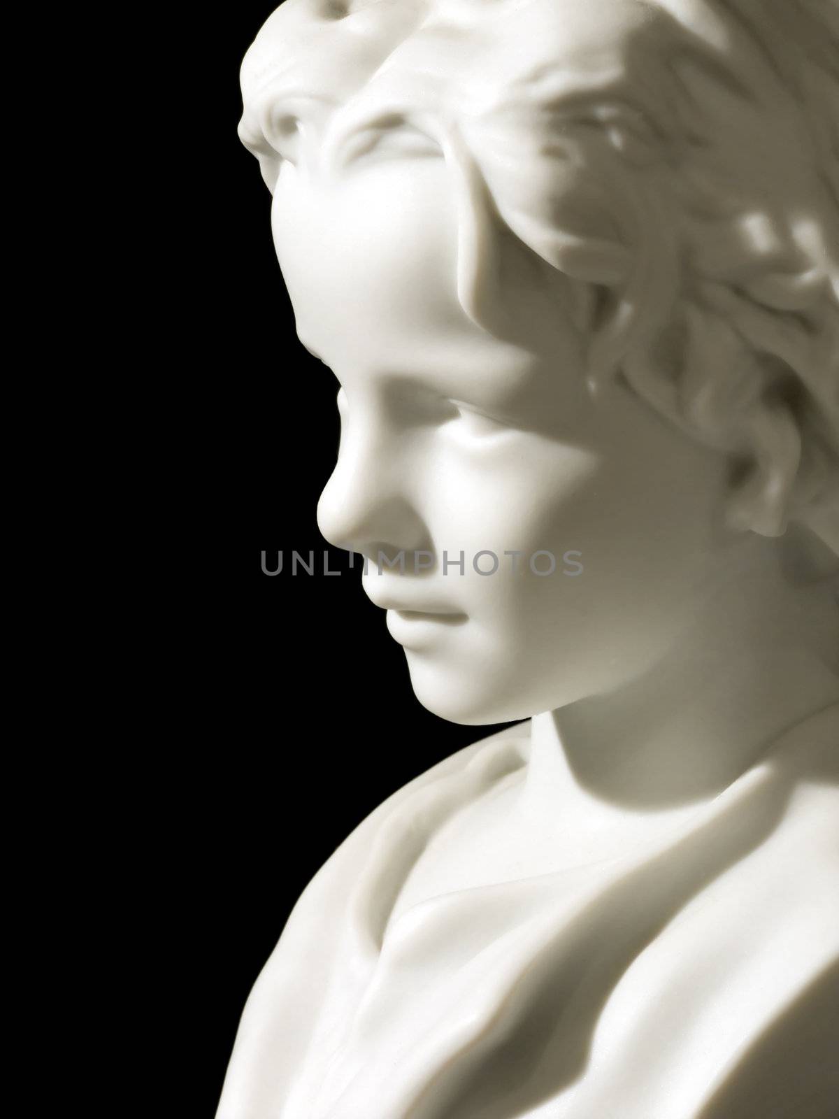 Porcelain boy head on a black background