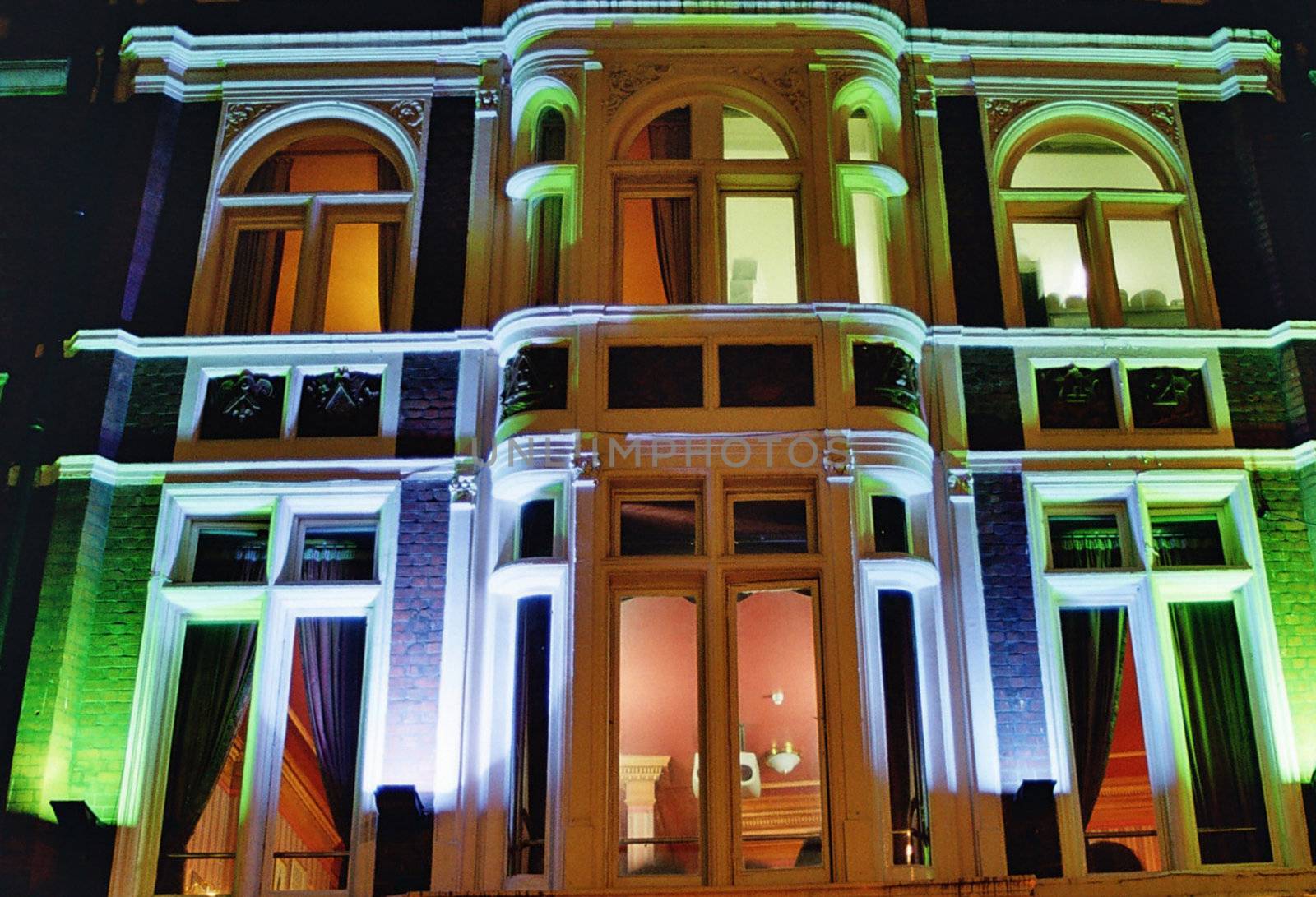 house fassade with colored lights in windows
