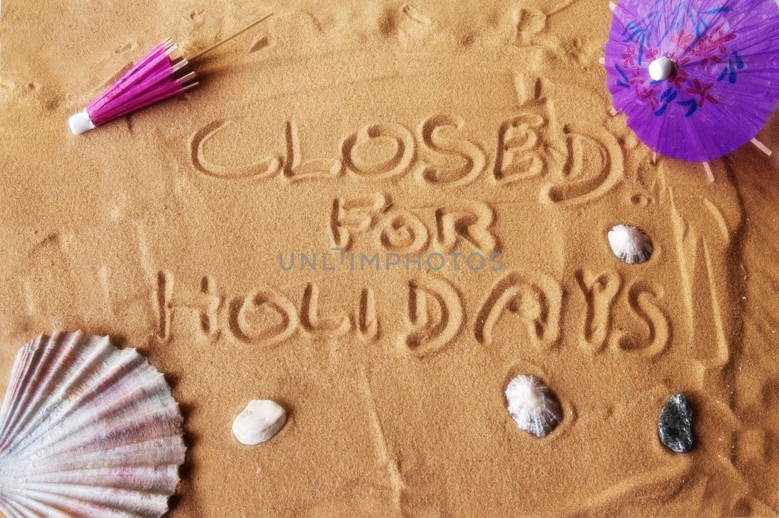 Closed for holidays written on sand by sil