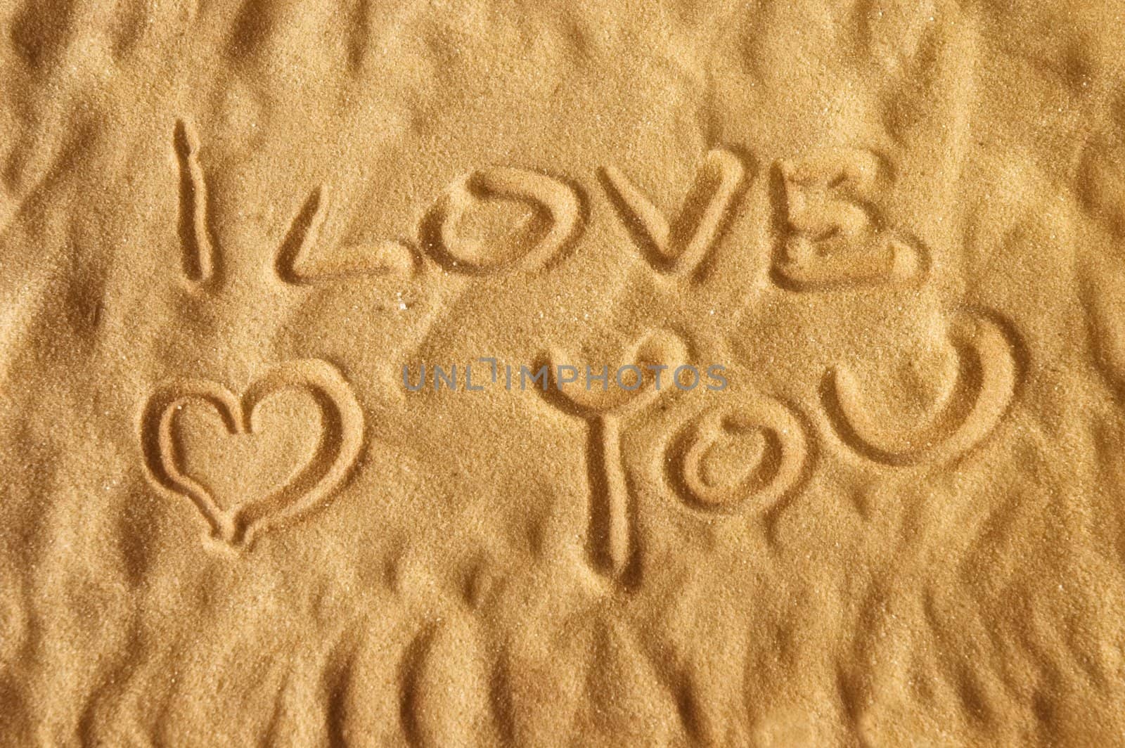 I love you witten on sand with and soft focus for dreamy atmosphere