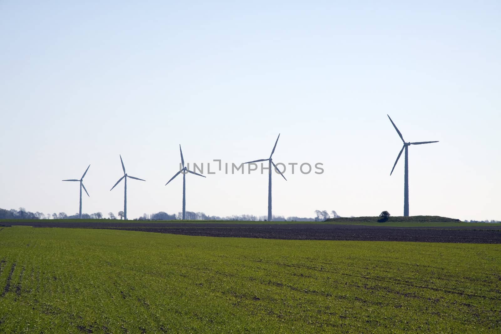 5 modern wind mills from Scandinavia, Sweden on a green field