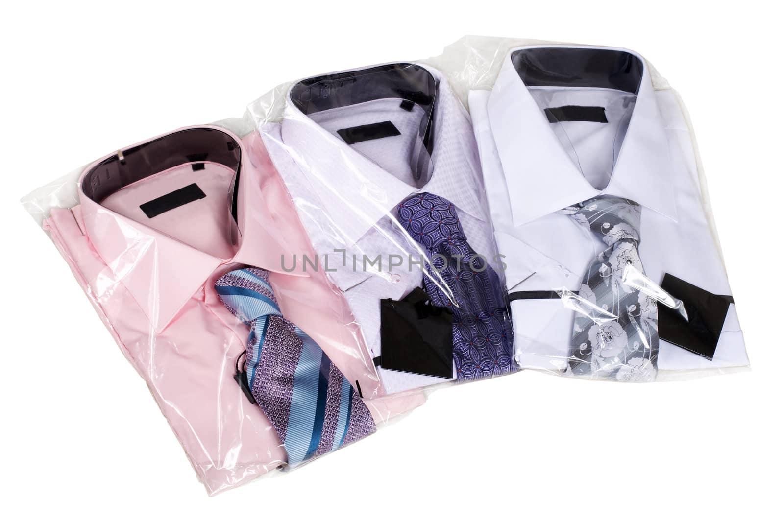 Three man's shirts with ties on a white background