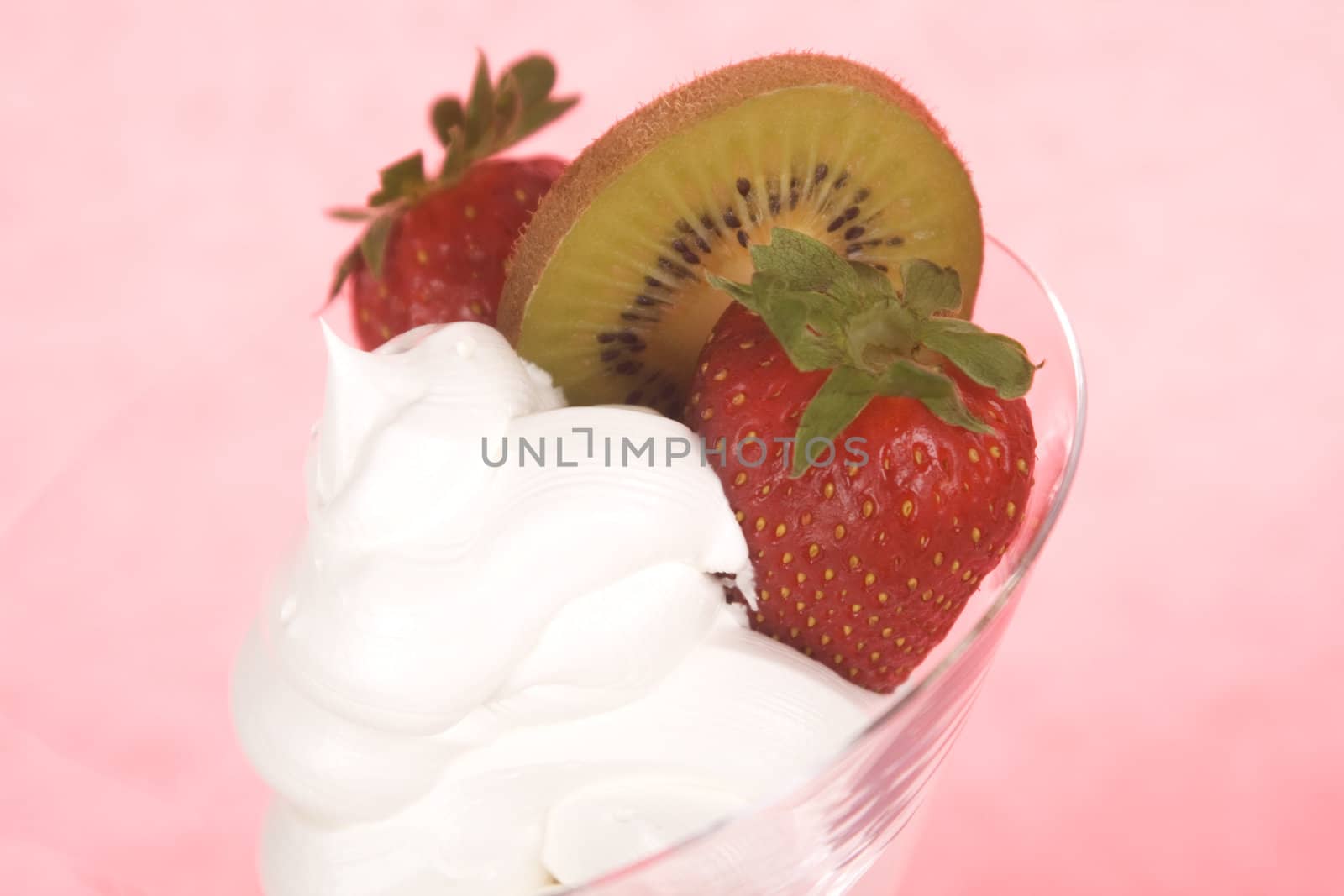 Closeup of cream and strawberries topping