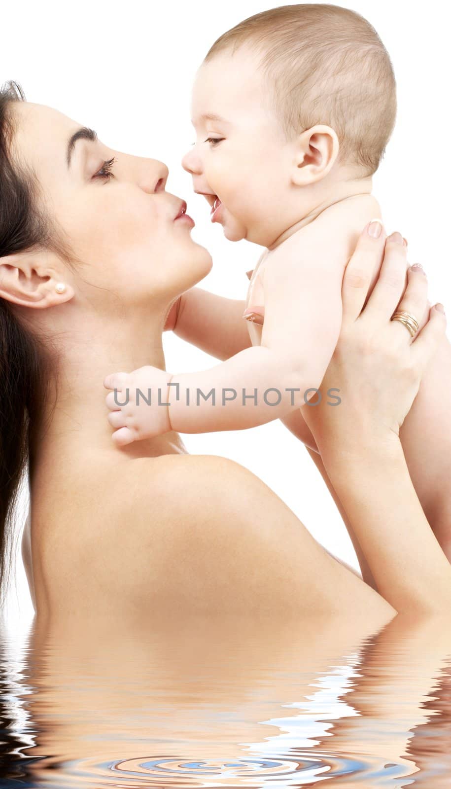 happy mother with baby in water by dolgachov