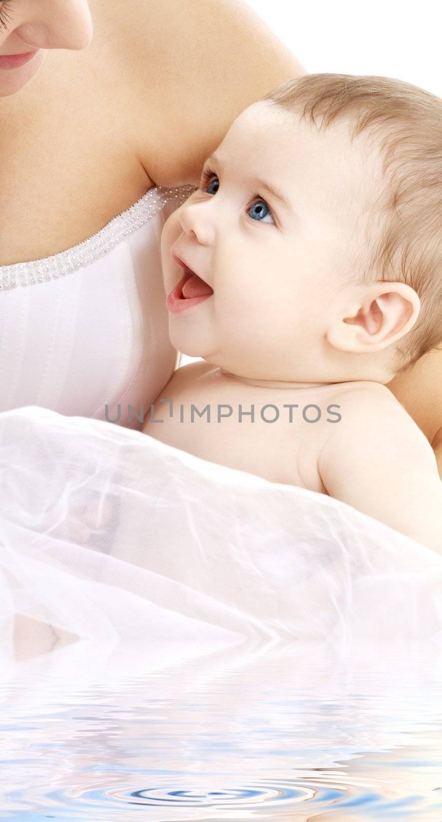 happy baby boy with mama in water by dolgachov