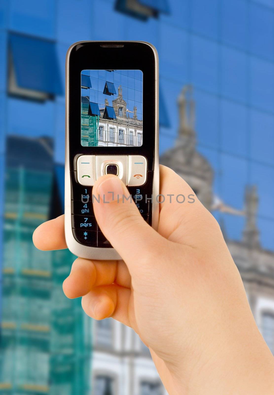 a technology cellular phone holding in a human hand