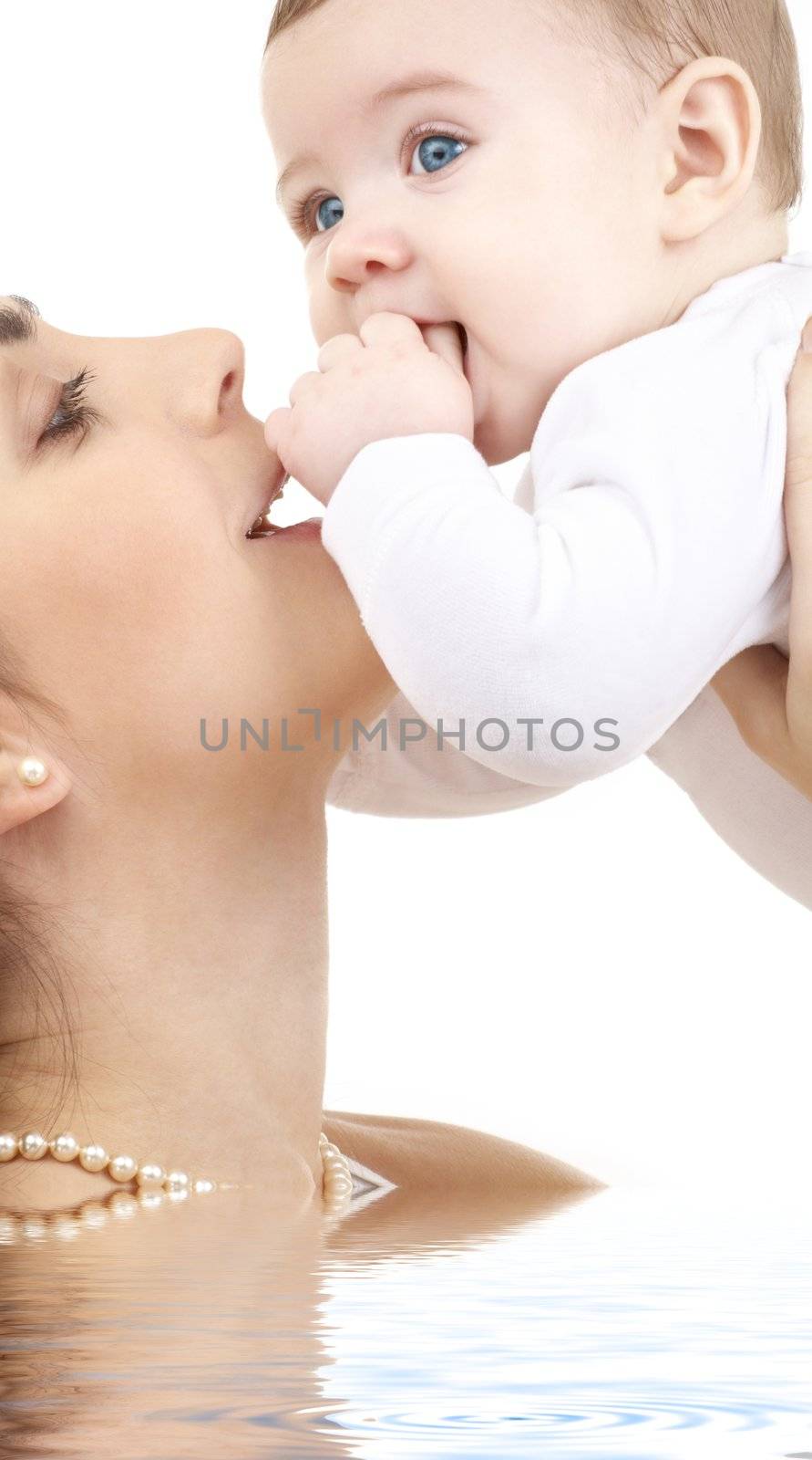 picture of happy mother with baby in water (focus on mother)