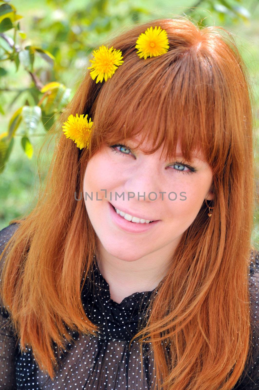 Beauty Redheaded Girl With Dandelions In Her Hair  by Reana