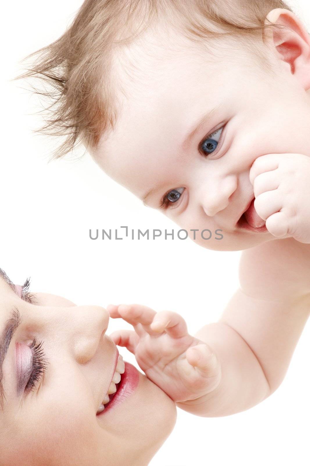 happy blue-eyed baby boy touching mama by dolgachov