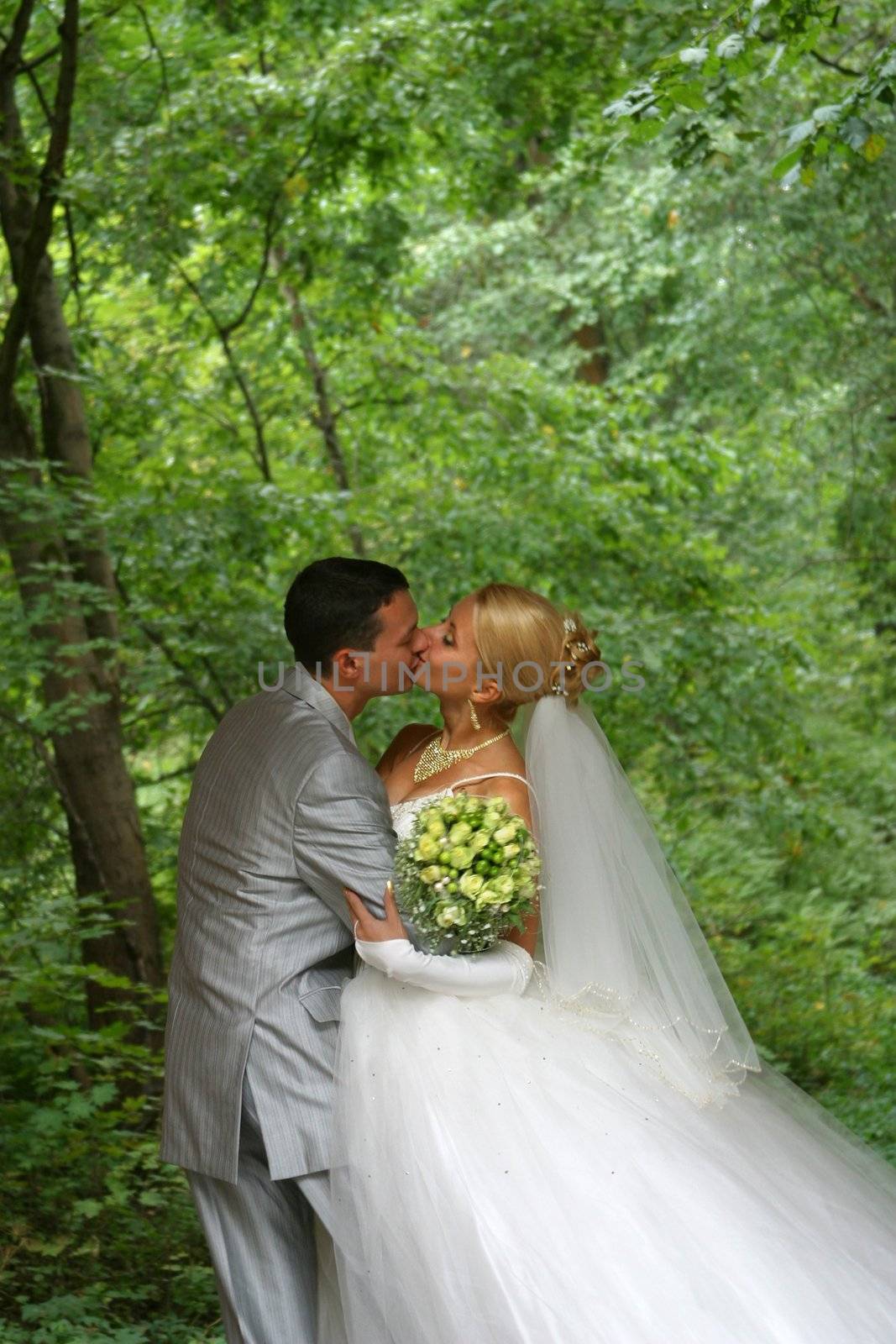 Newly-married couple in park