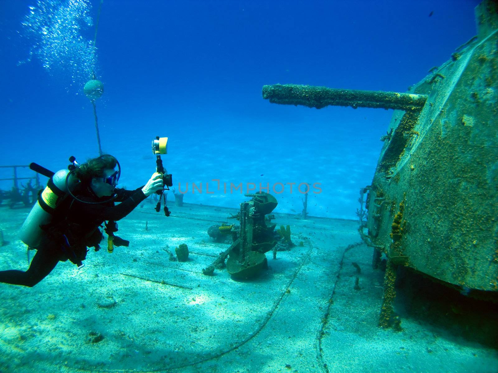 Underwater photographer shooting the MV Tibbetts in Cayman Brac