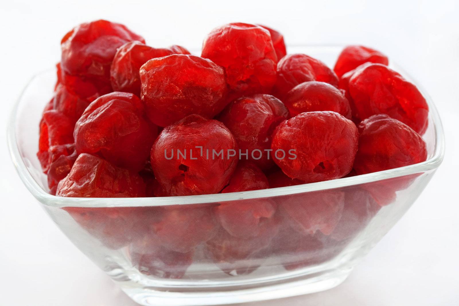 Dried up sweet cherry in a glass vase close up
