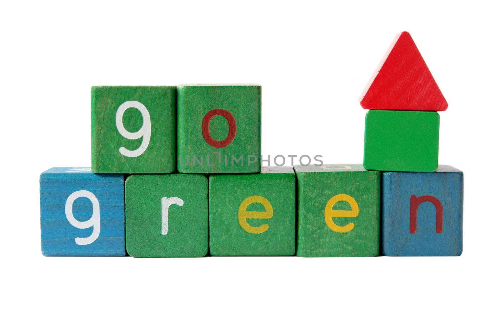 the phrase 'go green' in kids' blocks with a small house made from plain blocks