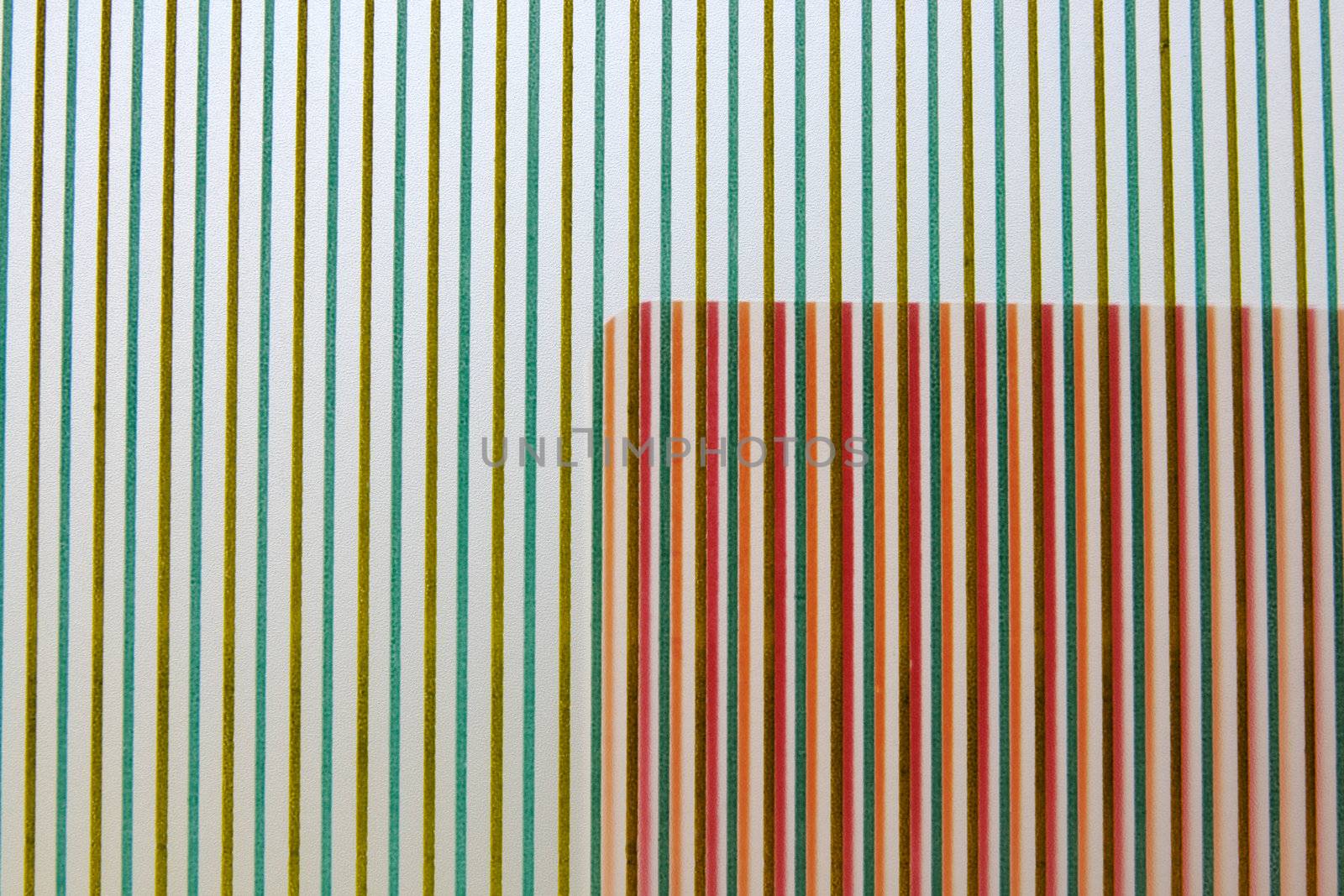 an area of warm stripes overlapping a background of cooler-colored stripes