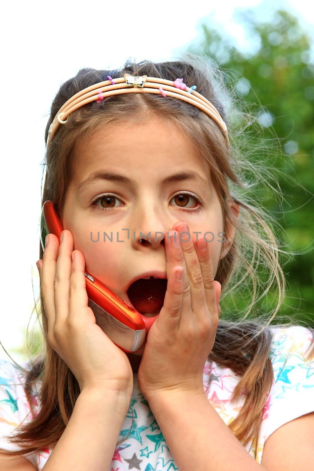 Beatiful young girl speaking on the phone 