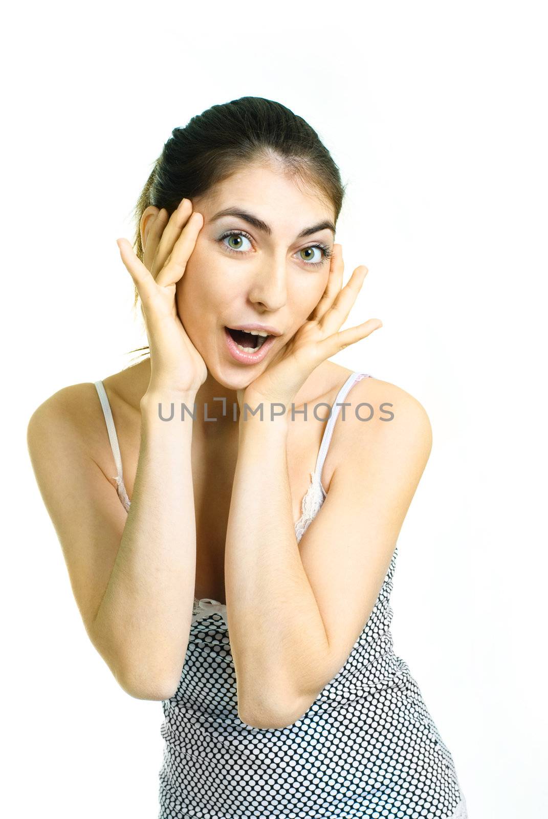 portrait of a beautiful young surprised woman closing her face with hands