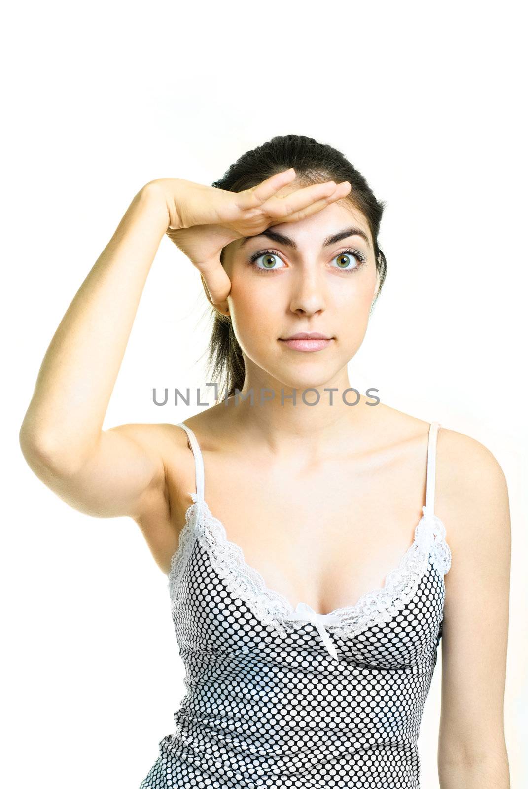 pretty brunette girl looking at something and closing her eyes from the Sun