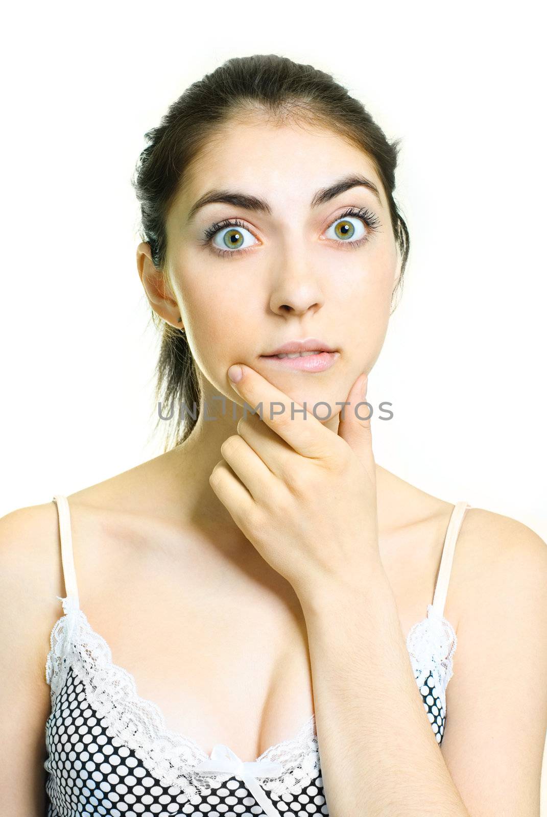 portrait of a beautiful young surprised woman against white background