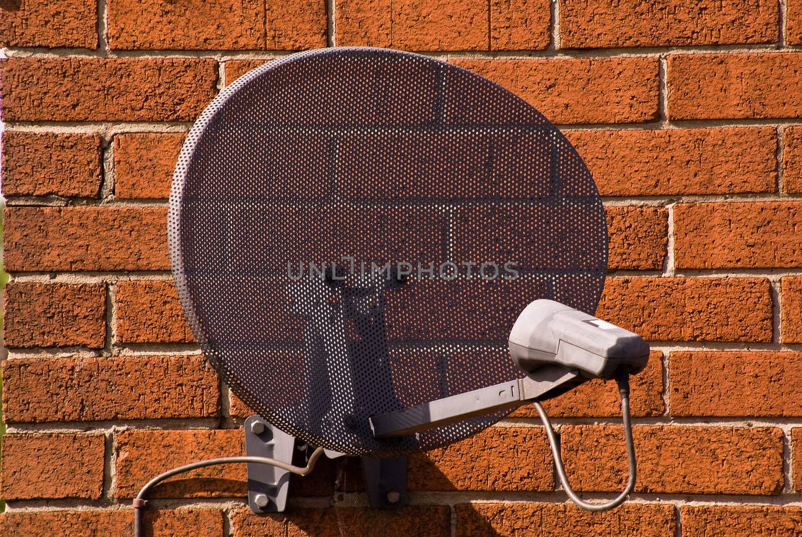 satellite antenna on the wall of one of the houses in the vicinity of Liverpool / United Kingdom, 16.05.2009 