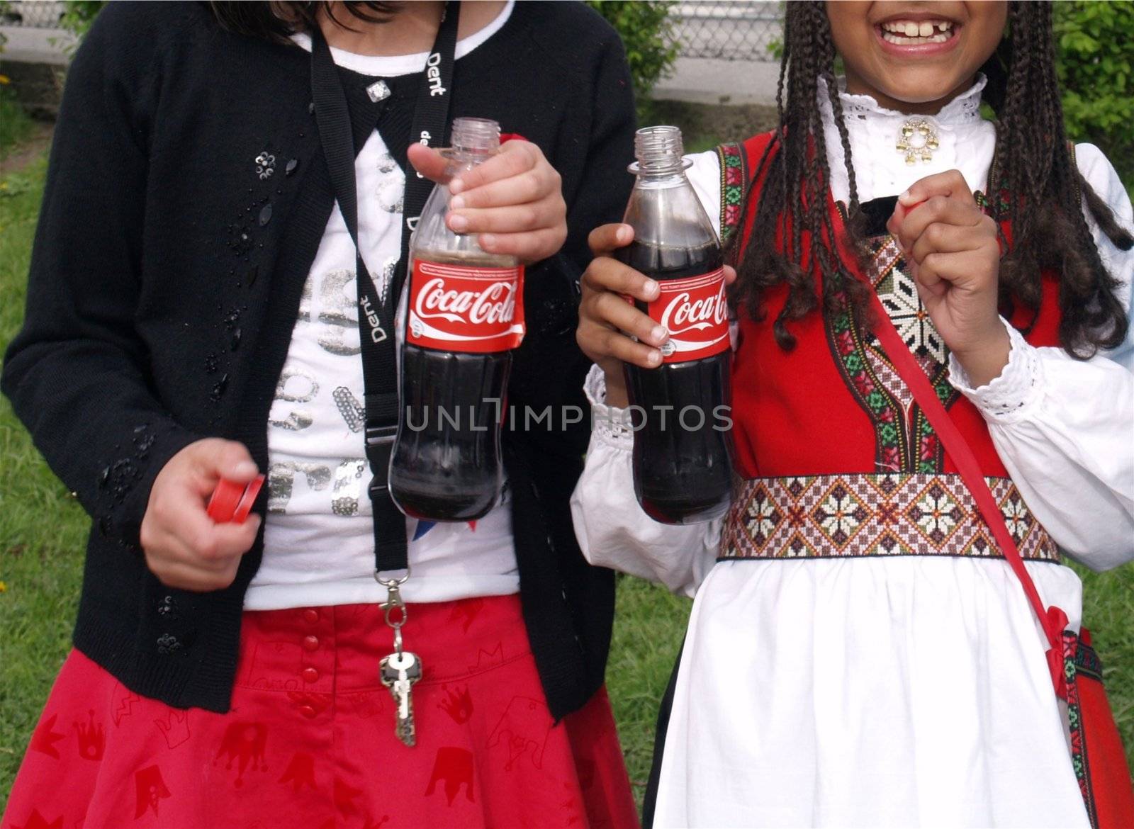 girls enjoying coca cola